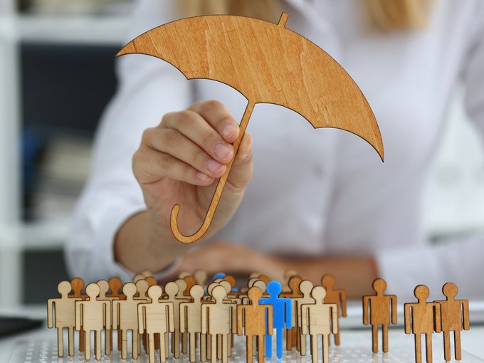 Businesswoman developing company strategy by using wooden figures