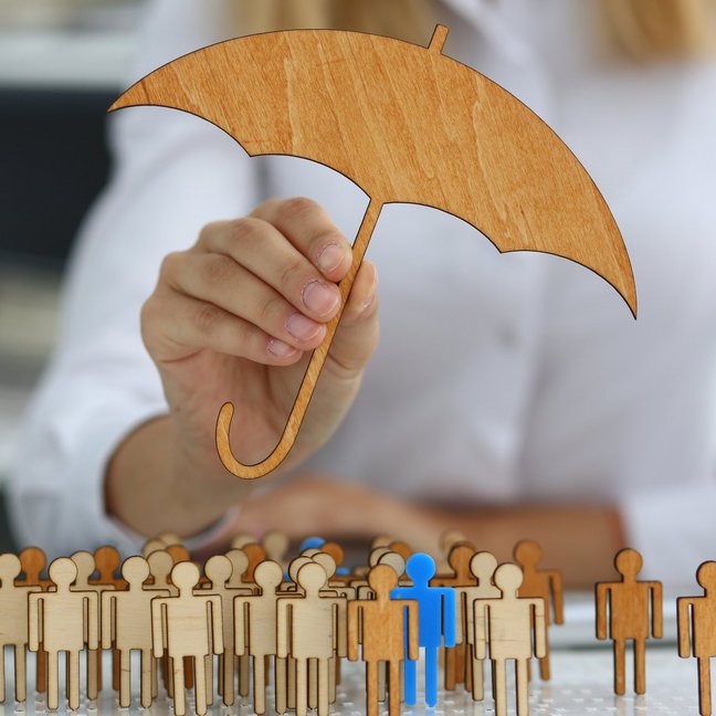 Businesswoman developing company strategy by using wooden figures